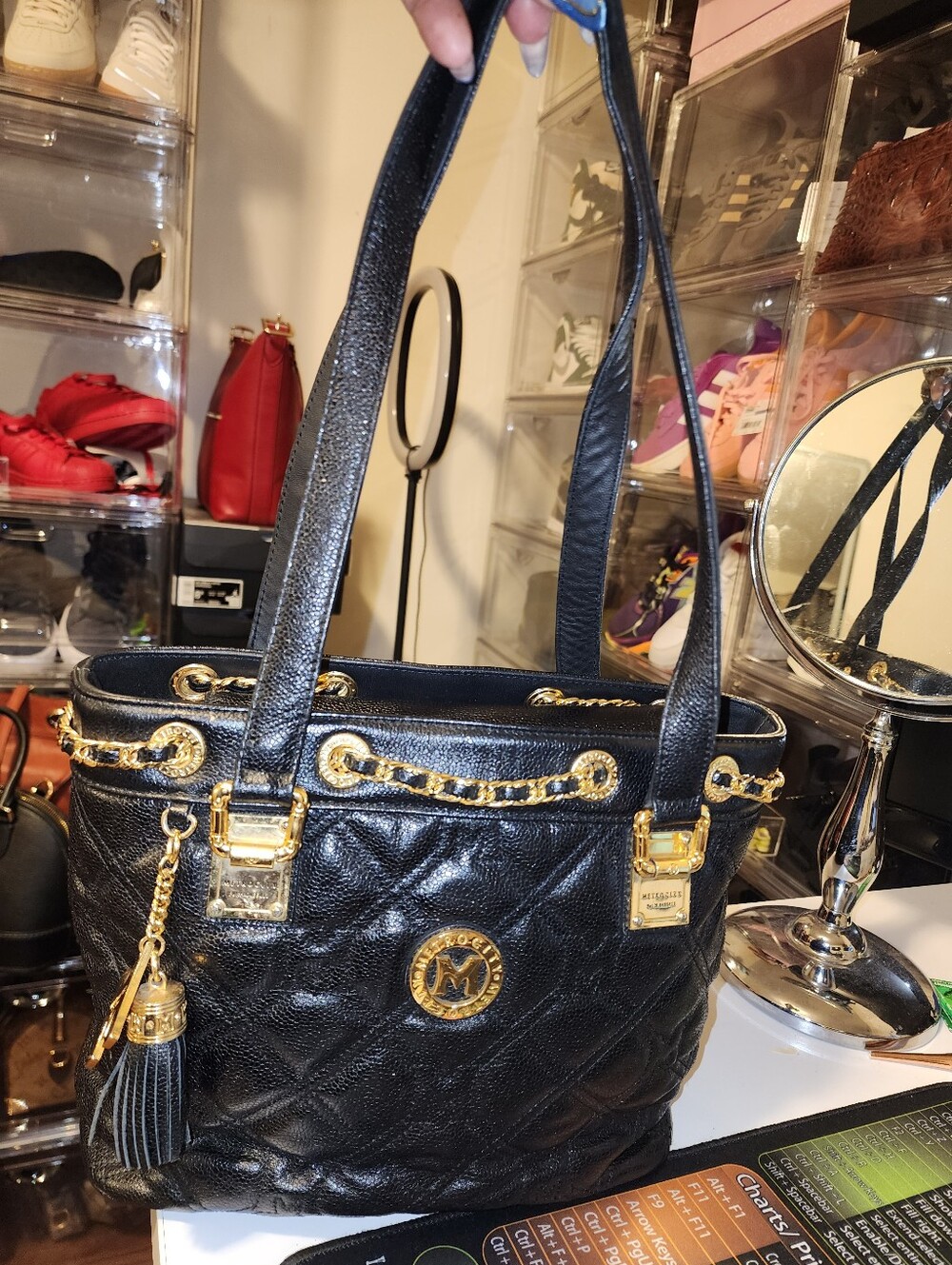 Metro City Black Quilted Leather Shoulder Bag with Gold Hardware.